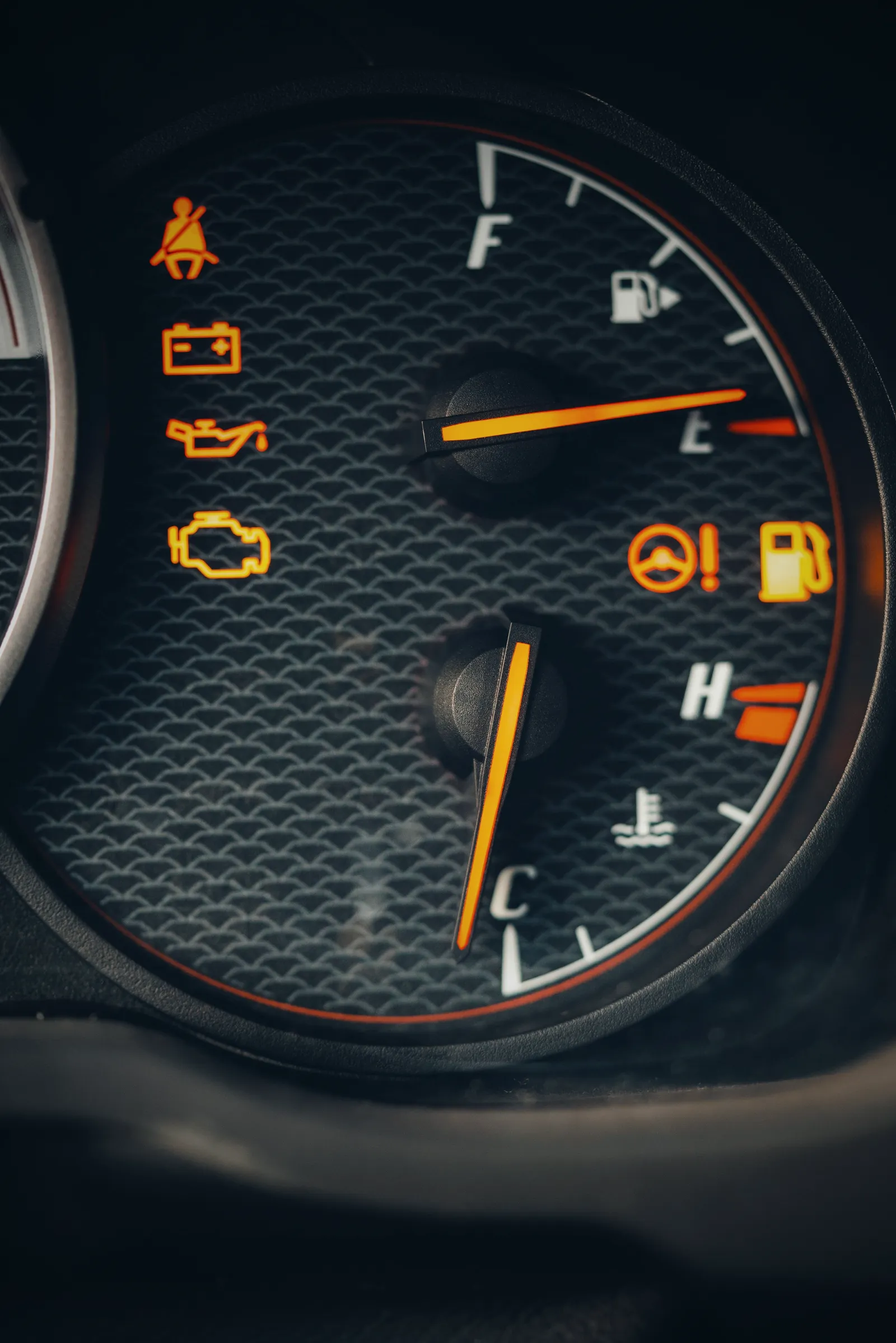 Instrument cluster with amber check-engine, battery, oil and seatbelt warnings lit