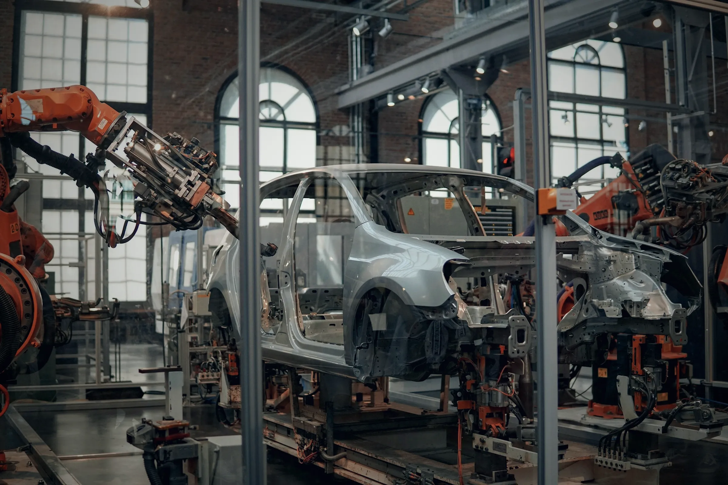 A car body on an assembly line among welding robots