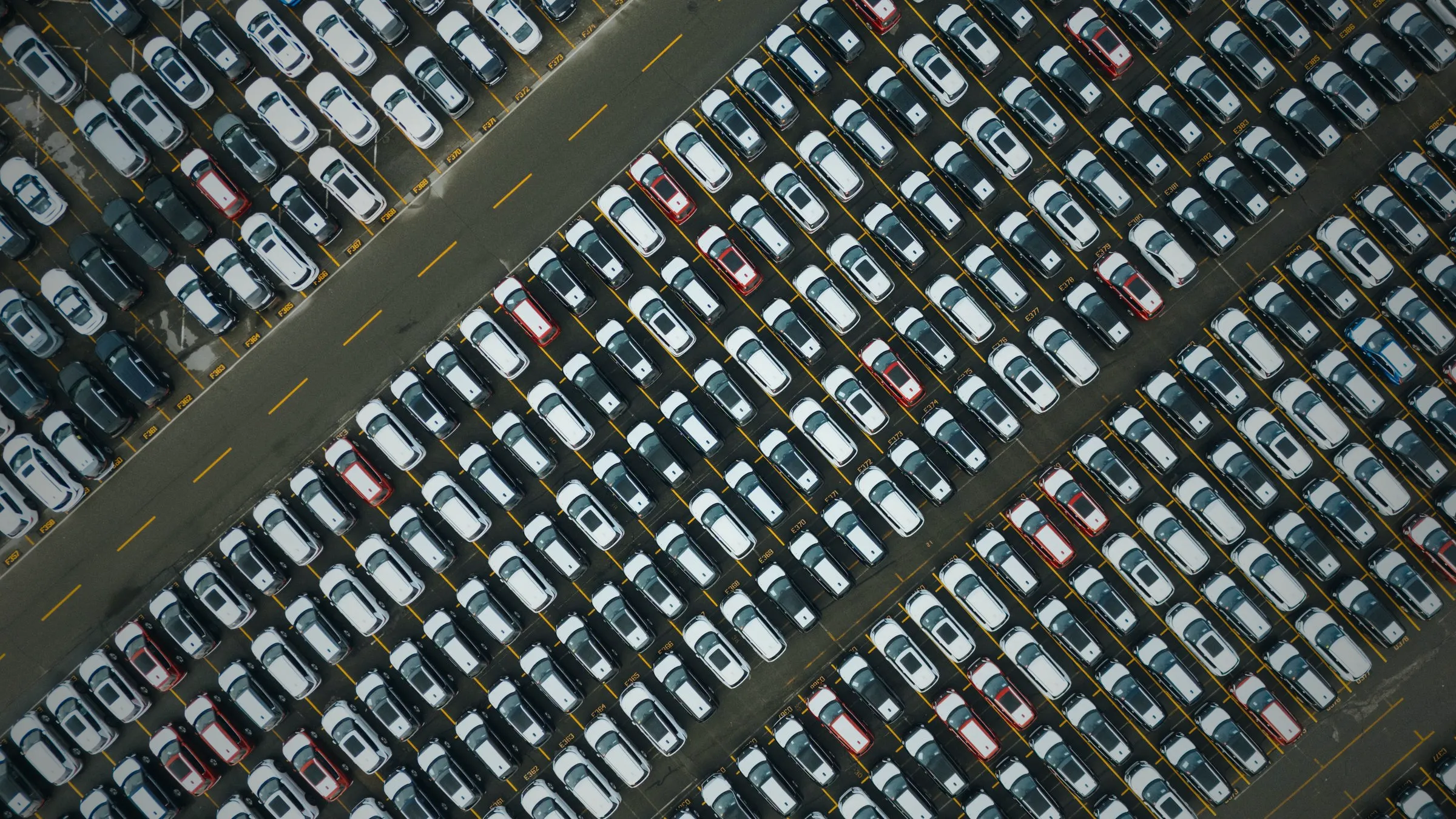 Rows of parked vehicles seen from above